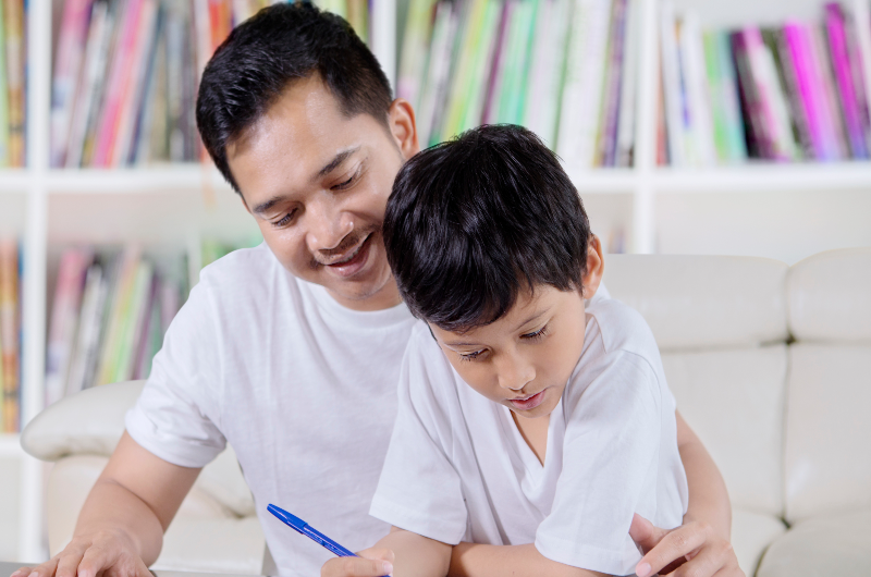 Dad teaching kid homework